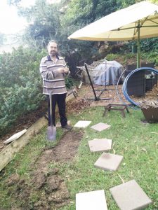 Chris laying paving slabs for fire area